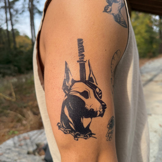 SteezyInk Doberman's Blade Temporary Tattoo on arm, bold black design, up to two weeks wear