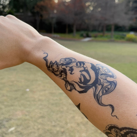 Mind Still Temporary Tattoo on arm. Featuring Pure Black Ink™, semi-permanent, two-week duration.