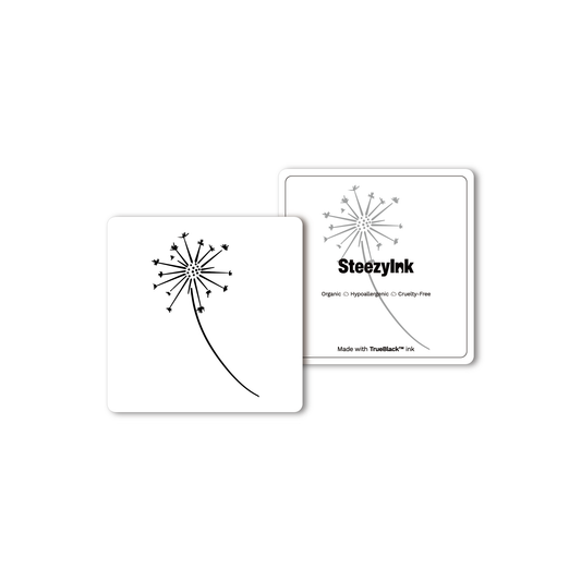 Dandelion Dream temporary tattoo design with Pure Black Ink™. A black dandelion seed head on white card.