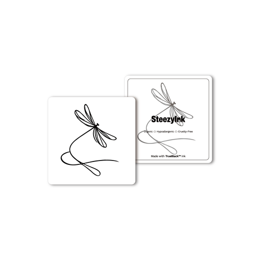 Mini dragonfly tattoo, minimalist design, black ink, Pure Black Ink™.