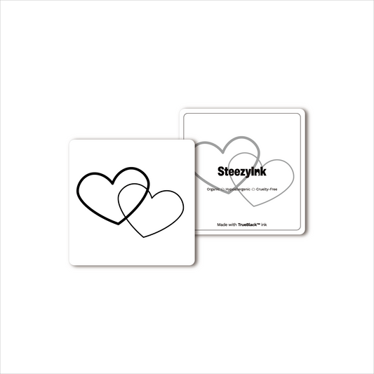 Linked Hearts temporary tattoo design, featuring intertwined hearts made with Pure Black Ink™