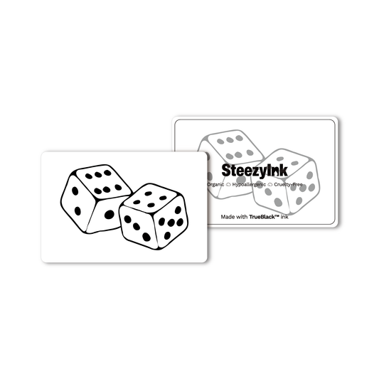 Lucky Roll temporary tattoo design featuring two dice, black ink, made with Pure Black Ink™