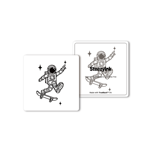 Space Skate temporary tattoo featuring an astronaut skateboarding with Pure Black Ink™