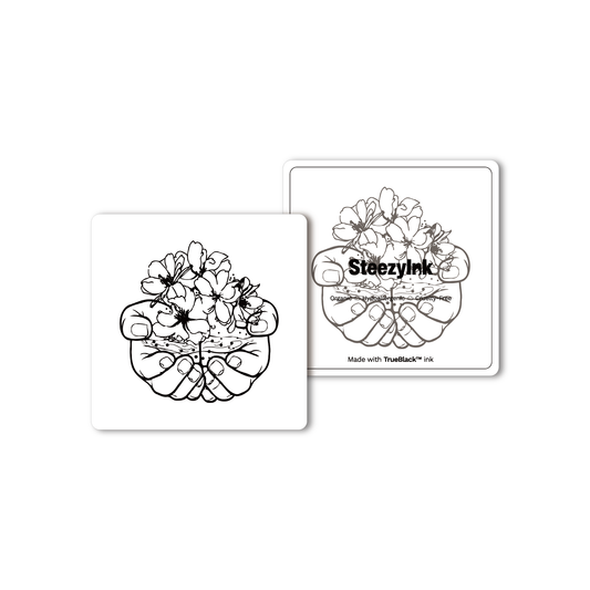 Hands of Nature temporary tattoo with Pure Black Ink™, floral design in hands. Organic, hypoallergenic, cruelty-free.