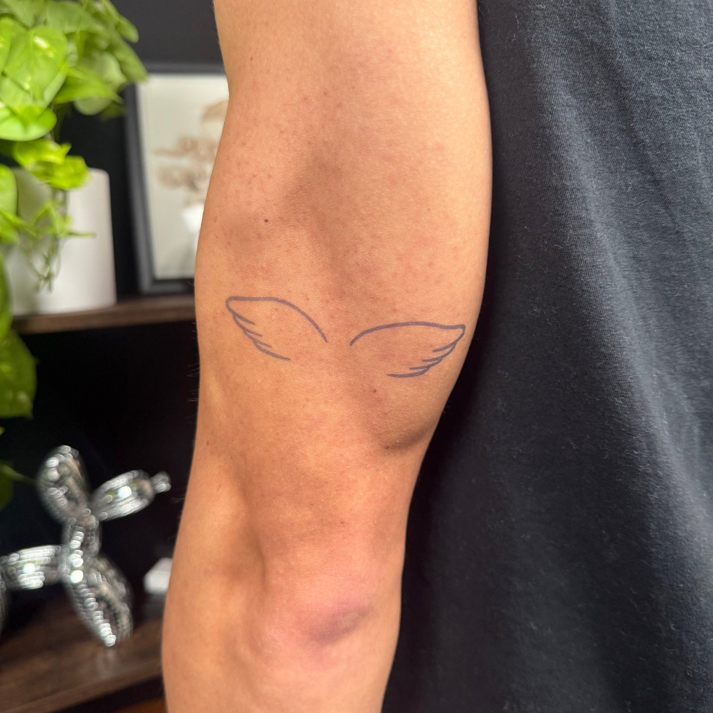 Angel Wings Temporary Tattoo on arm, minimal wing design, Pure Black Ink™