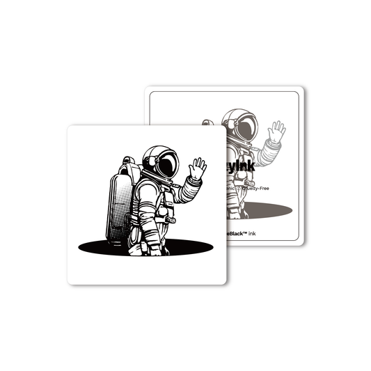 SteezyInk Waving Astronaut Temporary Tattoo, black design with PureBlack™ ink, skin-safe body art.