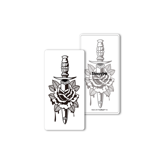 Rose Dagger Tattoo: black dagger piercing rose design, Pure Black Ink™ for semi-permanent style.