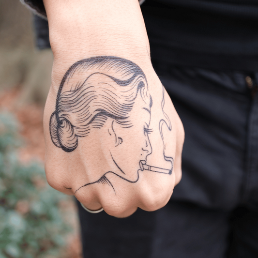 SteezyInk Smoking Lady Temporary Tattoo on hand. Retro woman with cigarette, up to 2 weeks wear.