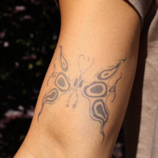 SteezyInk Flare butterfly temporary tattoo on arm, semi-permanent, skin-safe, plant-based ink